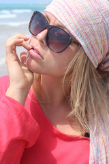 Naklejka premium A beautiful blonde at the beach