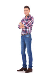 trendy man standing with arms crossed