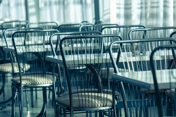 Foto op Plexiglas anti-reflex Photo of a canteen with metal chairs and tables © Sved Oliver