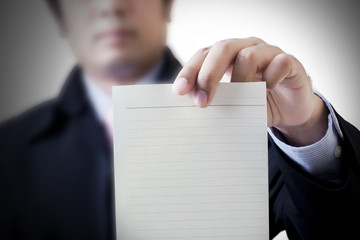 Businessman holding white billboard