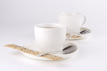 Two teacups with cookies