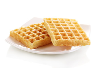 Sweet waffles on plate isolated on white