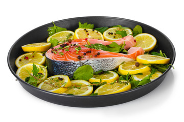 Red fish with lemon, parsley and pepper