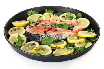 Red fish with lemon, parsley and pepper