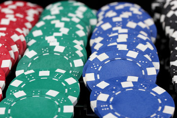 Casino chips close-up isolated on black