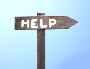 Help wooden board on blue background