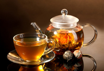 glass teapot and cup with exotic green tea