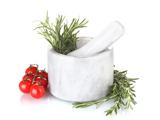 fresh green rosemary in mortar and tomatoes cherry isolated