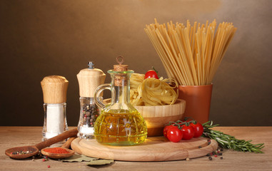 spaghetti, noodles in bowl, jar of oil and vegetables