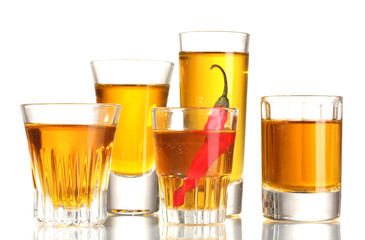 glasses of pepper vodka and red chili pepper isolated on white