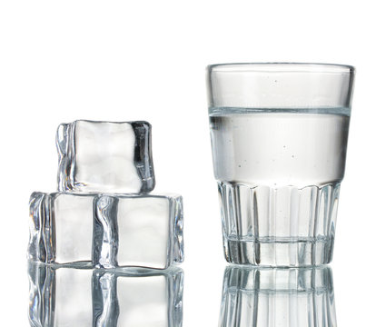 glass of vodka with ice isolaled on white