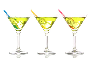 Yellow cocktail in martini glasses isolated on white