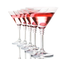 Red cocktail in martini glasses isolated on white