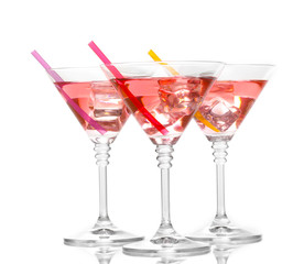 Red cocktail in martini glasses isolated on white