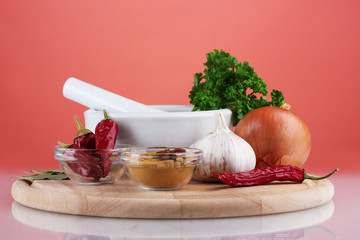 Composition of White mortar and pestle with spice and