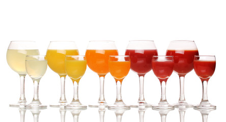 Tropical juices in glasses isolated on white