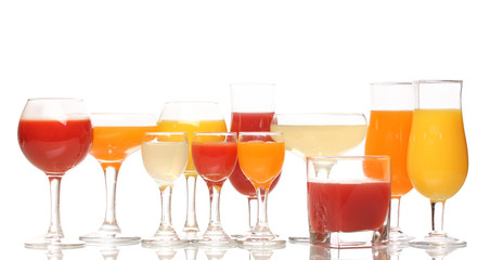 Tropical juices in glasses isolated on white