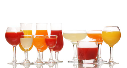 Tropical juices in glasses isolated on white