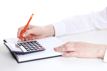 women hands with pencil, notebook and Calculator isolated