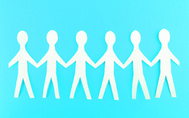 Paper people on blue background