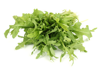 Fresh rucola salad or rocket lettuce leaves isolated on white