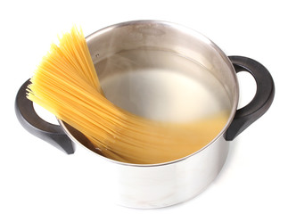 Cook the spagetti in the pan on white background close-up