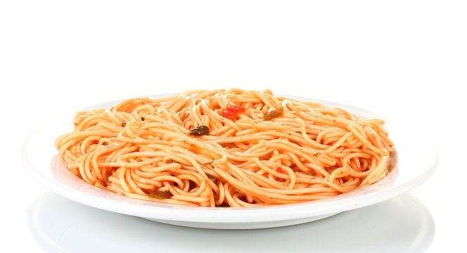 Italian spagetti cooked with tomato sauce in a white plate