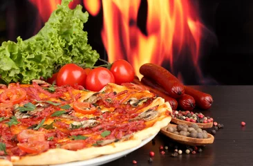 Foto op Plexiglas delicious pizza, salami, tomatoes and spices © Africa Studio
