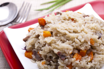 fried rice with chopped meats and vegetables.