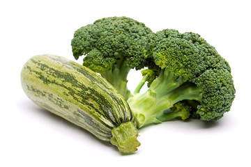 Broccoli and zucchini isolated on white background