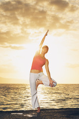 Fototapeta na wymiar Beautiful Yoga Woman at Sunset