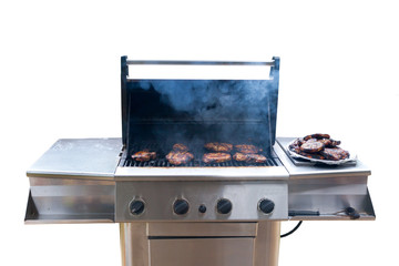 Pork steaks on gas grill on white background