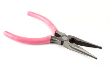 Pink pliers over white