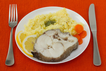 boiled fish with mashed potato and carrot
