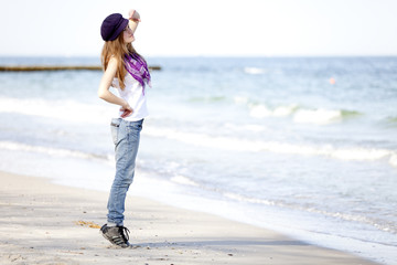 Funny teen girl near the sea.