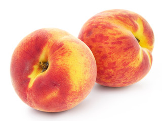 two peach fruits isolated on white background