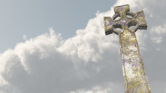 Kreuz vor wolkigem Himmel