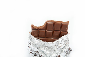 Chocolate bar in foil isolated on white background