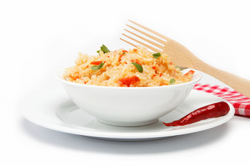 Rice in a bowl on a white background.