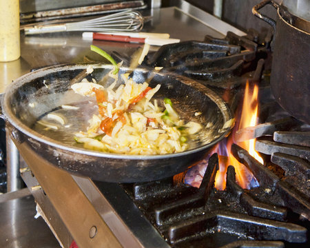 Vegetables Being Tossed in Skillet