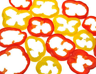 slices of red and yellow bell pepper arranged on white