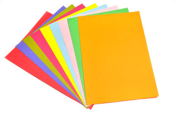 close up of colorful pastel papers spared on white