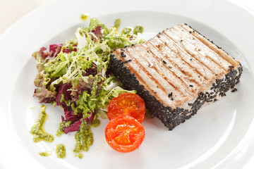 salmon steak with salad