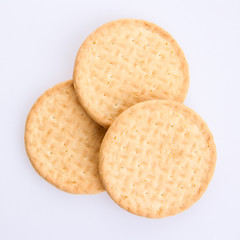 Three round biscuits on a grey background
