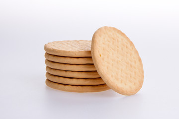 A stack of round biscuits on a grey background