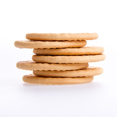 A stack of round biscuits on a grey background