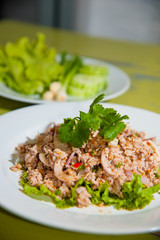 Larb chicken salad.Thai food with chicken, lime, chili, herbs