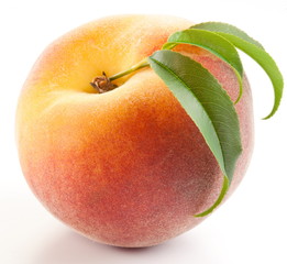 Ripe peach with leaves