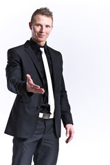 A business man with an open hand ready to seal a deal