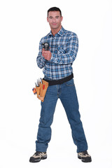 Handyman holding a cordless  powerdrill